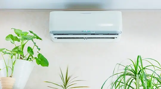 Ductless AC unit mounted on inside wall