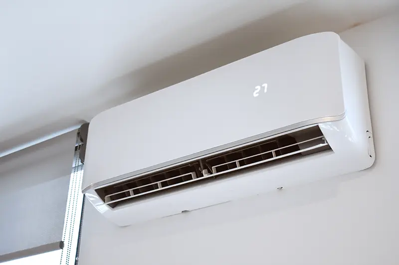 Ductless AC unit mounted on inside wall